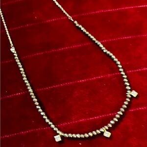 Goldtone Necklace with crystal accents.